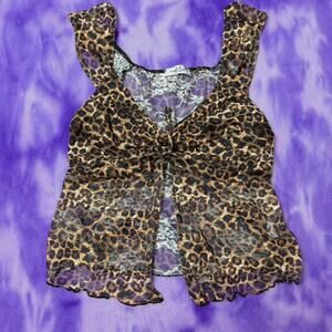 Rebellious Dreamer leopard print lace top with tie front.